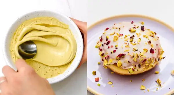 Pyszne pączki pistacjowe z lukrem i posypką z pistacji i płatków róży. Obok miska z kremem pistacjowym.