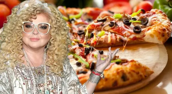 Magda Gessler zachęca do spróbowania swojej pysznej pizzy, która wygląda apetycznie z ciągnącym się serem.