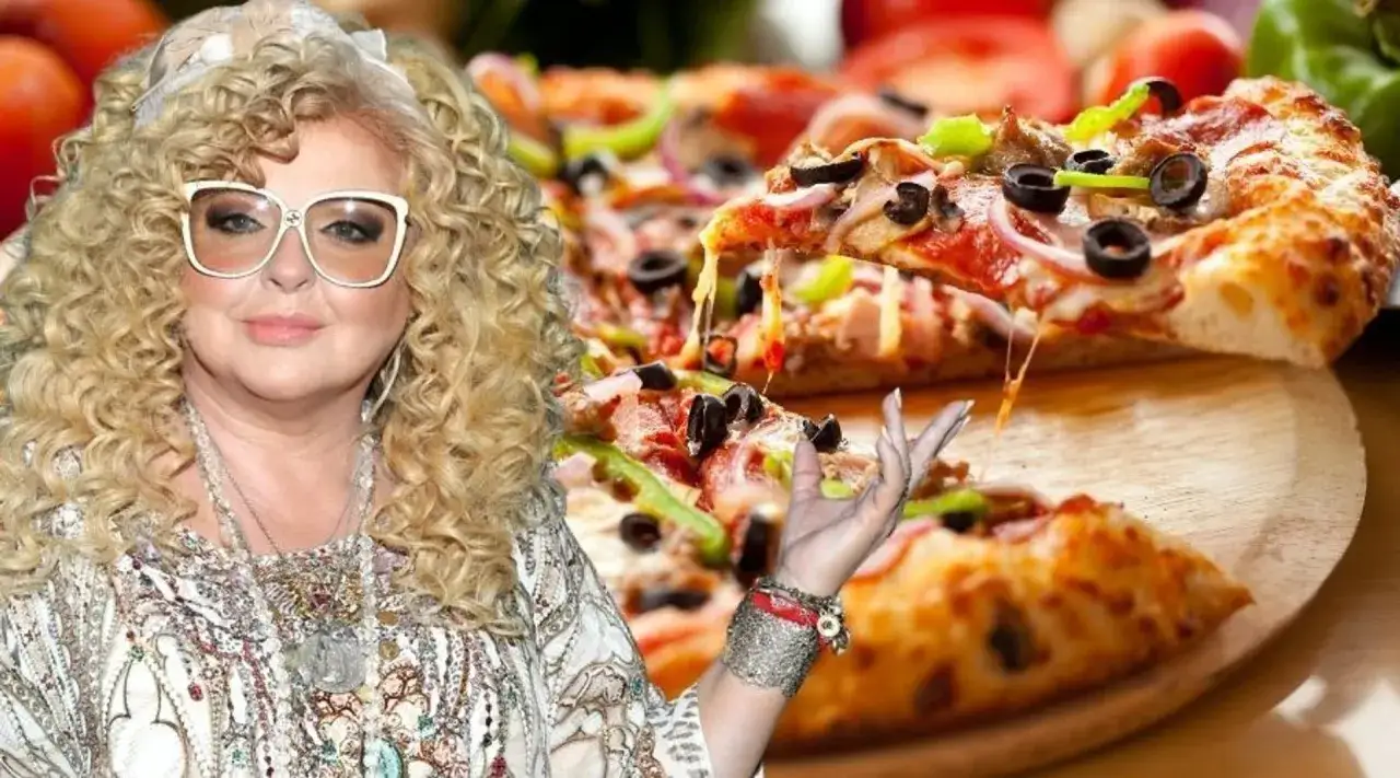 Magda Gessler prezentuje pyszną pizzę z ciągnącym się serem.